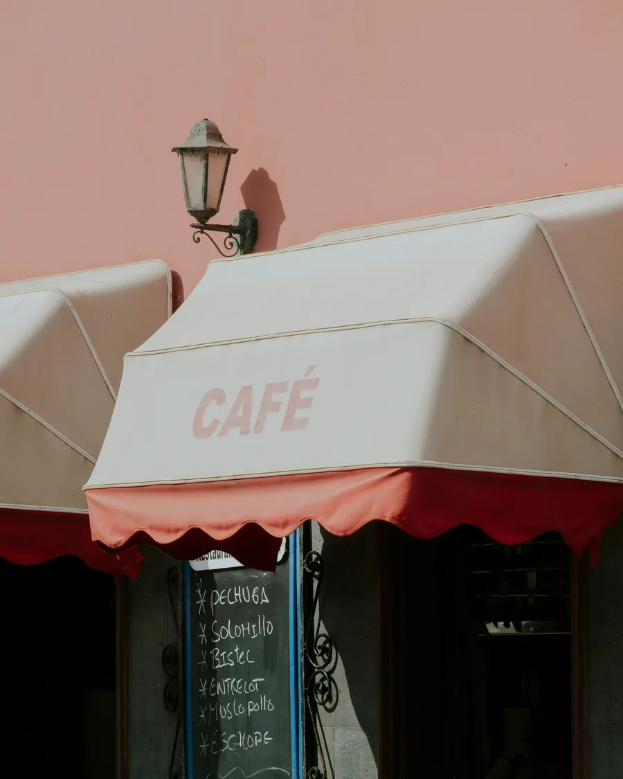 Neighbourhood café in the Canary Islands with its hand-written chalkboard menu, an example of a local business
